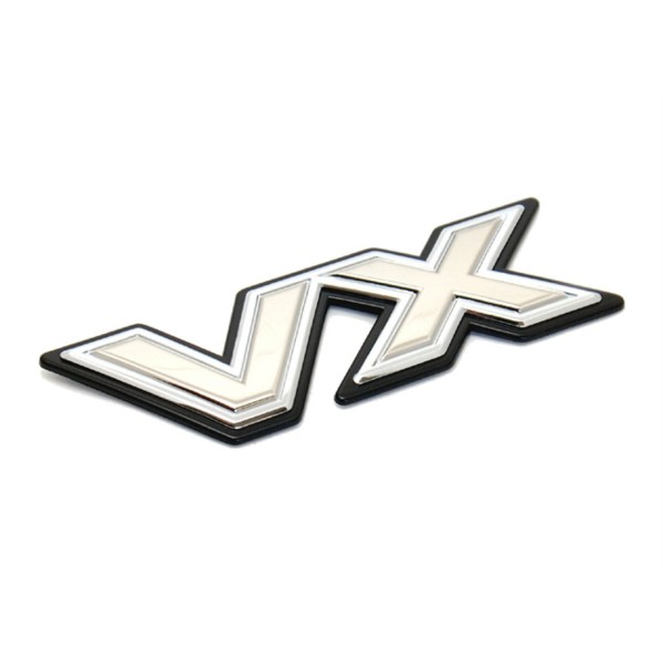 EMBLEMA PORTON TRASERO  J8 " VX " ORIGINAL TOYOTA LAND CRUISER