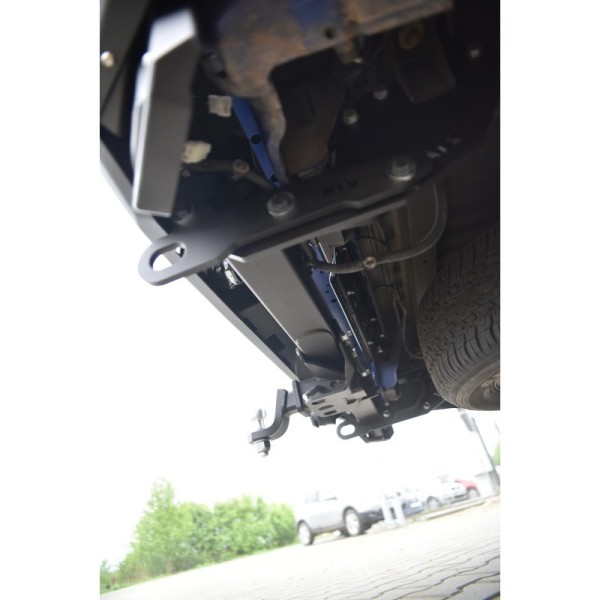 Rear bumper made of reinforced steel with a tow...